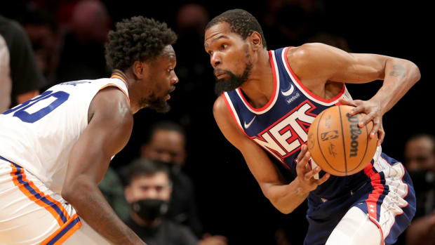 Nov 30, 2021; Brooklyn, New York, USA; Brooklyn Nets forward Kevin Durant (7) drives around New York Knicks forward Julius Randle (30) during the second quarter at Barclays Center. Mandatory Credit: Brad Penner-USA TODAY Sports